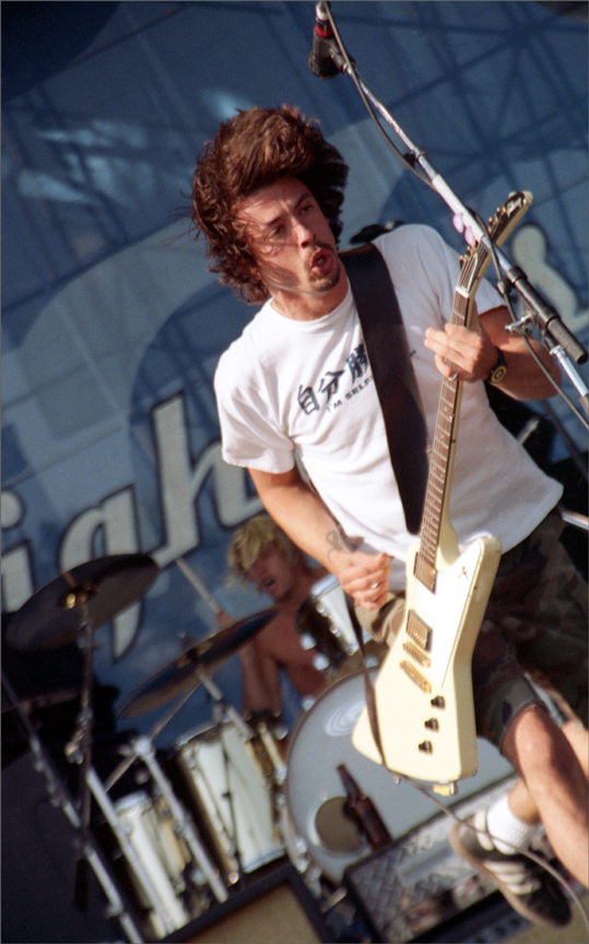 Close-up of The Tragically Hip drummer in action